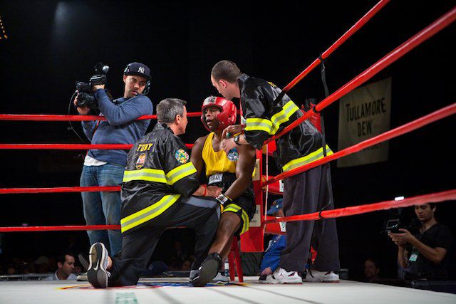 FDNY Boxing President & Head Coach Bobby McGuire (left) and trainer Mike Reno give advice to fighter Shariff "The Sheriff" Farrow